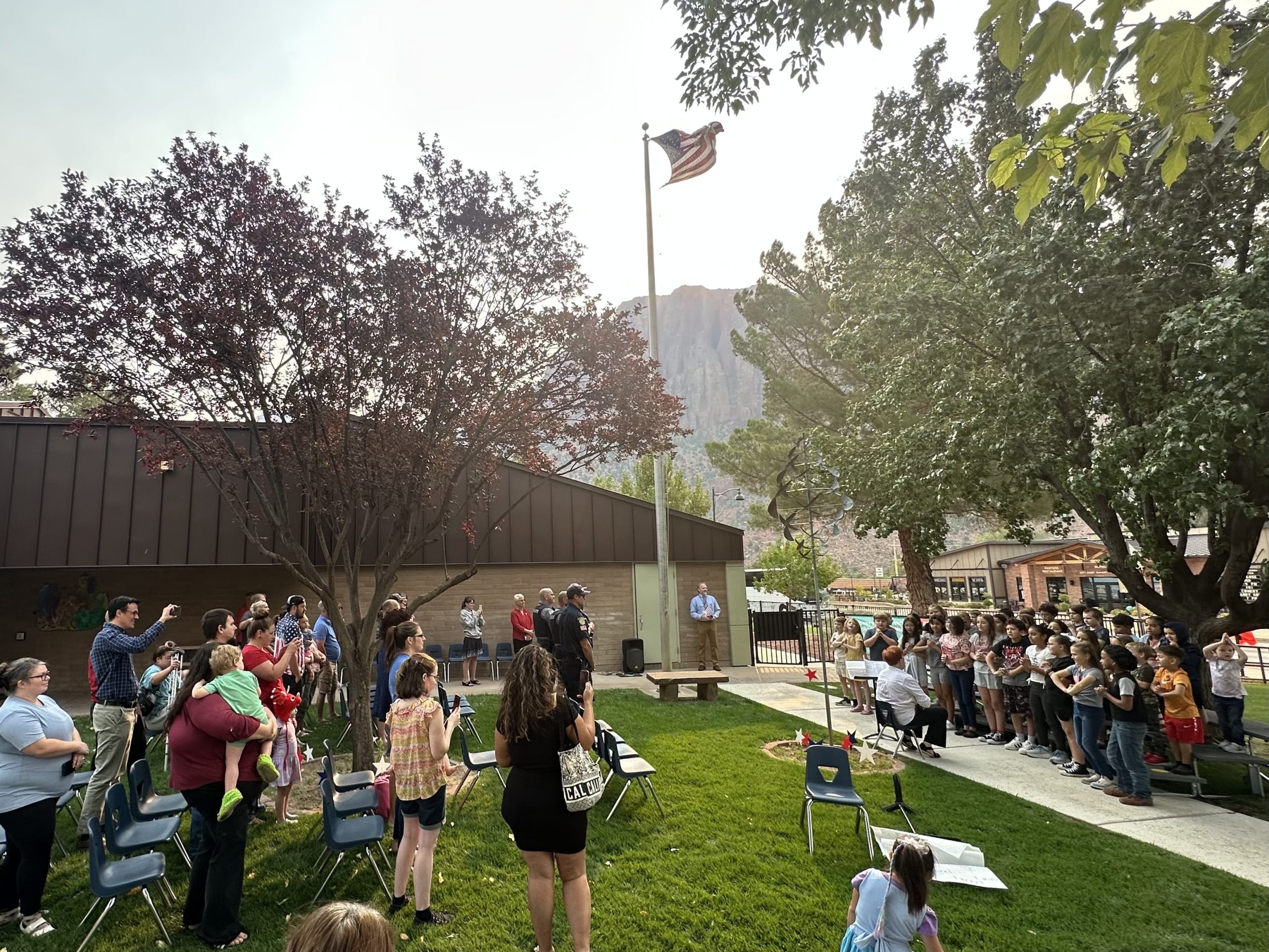 Students singing during the Hero Program on 9/11 in front of the school.