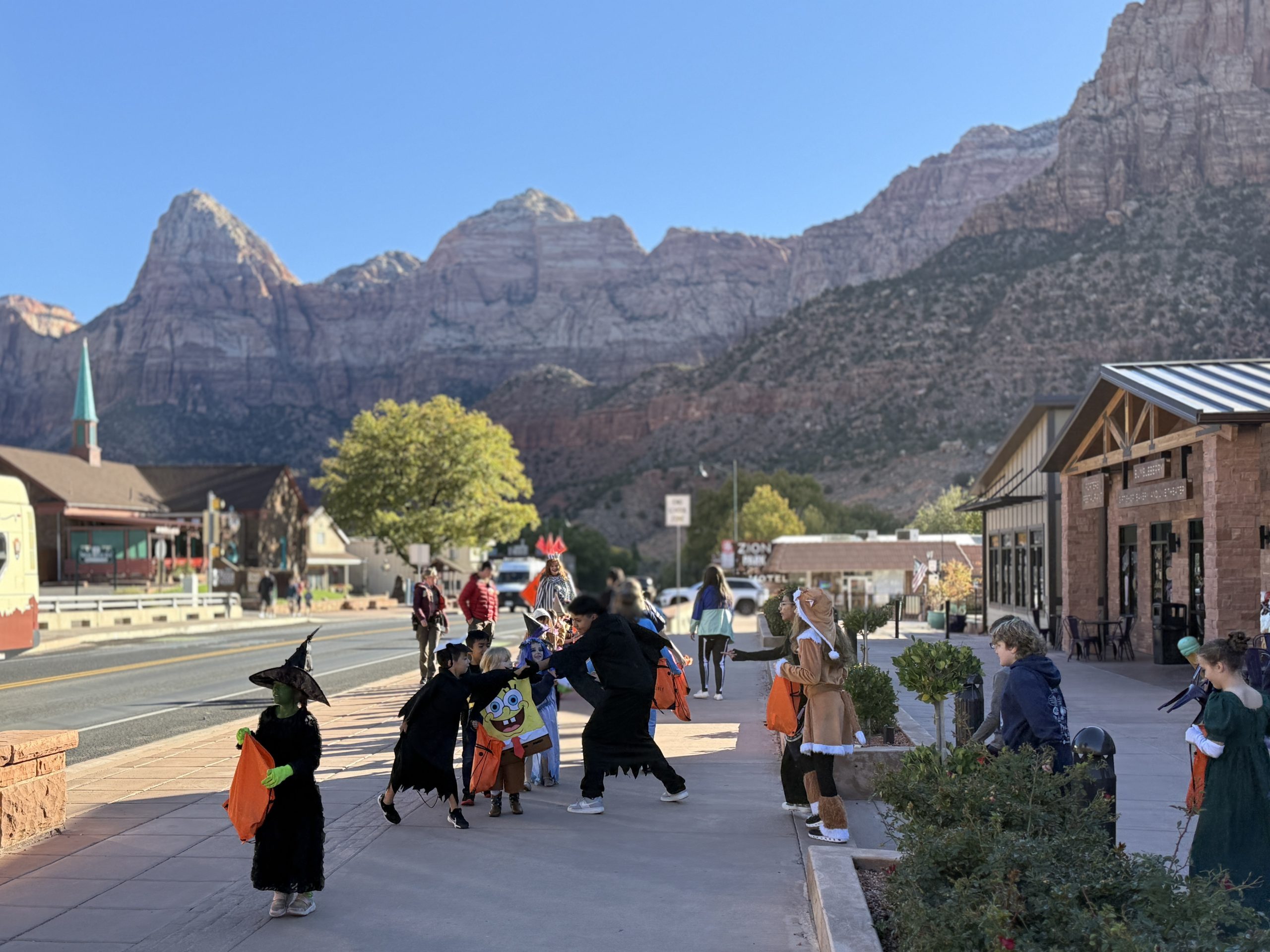 Students in costumes walking in a Halloween Parade