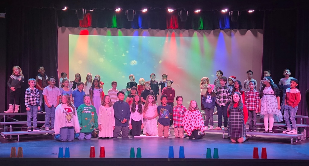 Springdale Elementary Christmas Program with students singing while standing on the risers.