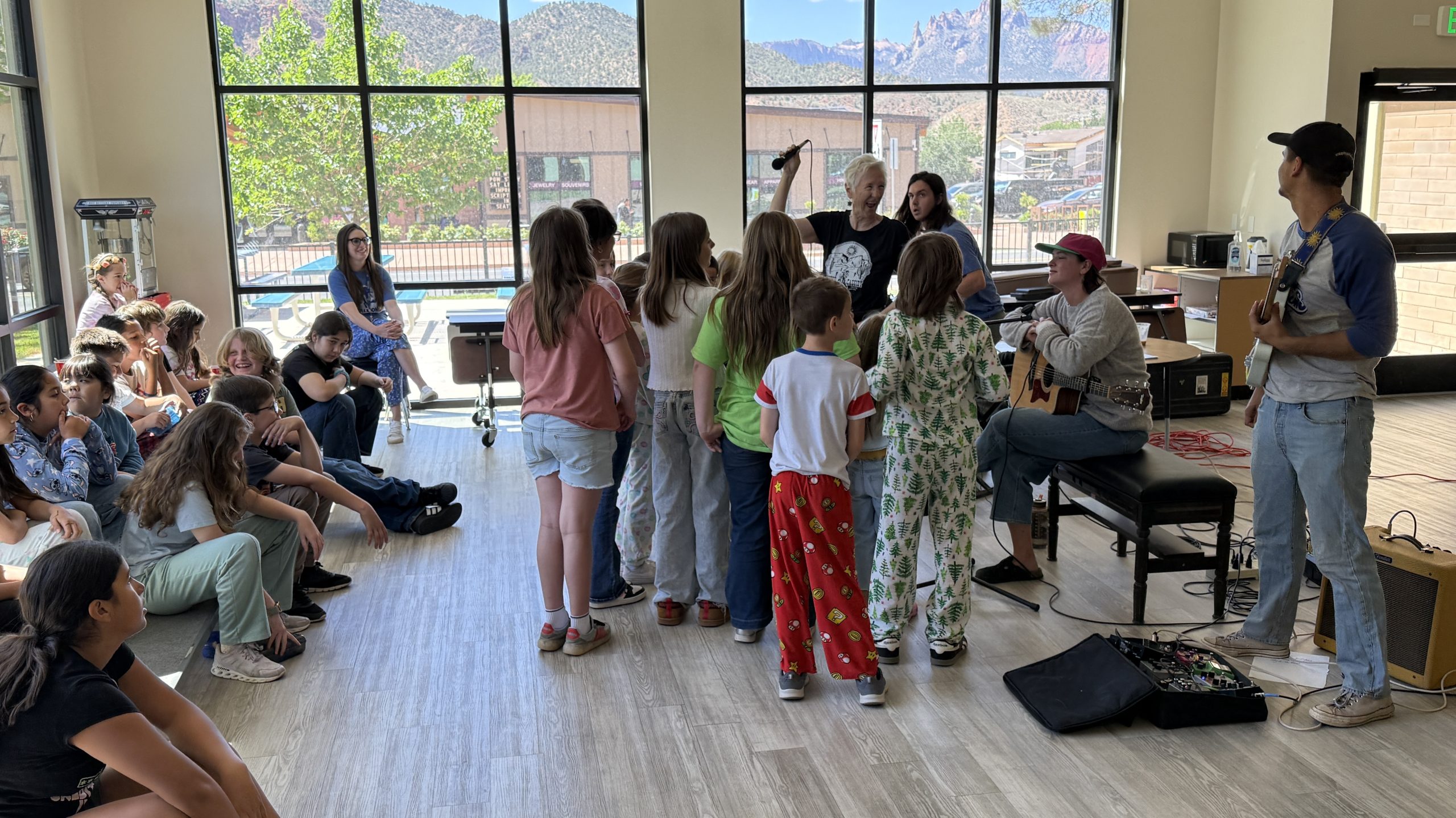 Students singing with the band Holliday as they present and play.
